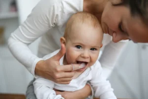 Being a parent can be both exhilarating and overwhelming, as it is filled with numerous decisions and milestones that shape your child's development. One such pivotal decision that requires careful consideration is when to introduce your little one to the dental world. As a leading pediatric dentist in Hallandale Beach, Dr. Yamila Garber is committed to guiding you through this crucial stage, ensuring your child's dental health is nurtured from the very beginning. The Importance of Early Dental Care Introducing your child to dental care early on is crucial for their long-term oral health. The American Academy of Pediatric Dentistry recommends that a child should visit a dentist by their first birthday or within six months after their first tooth appears. Early dental visits help in detecting potential issues and inculcating good oral hygiene habits from a young age. As the best pediatric dentist in Hallandale Beach, Dr. Garber ensures that your child's initial dental experiences are comfortable and positive. Choosing the Right Dentist Choosing the right dentist for your child is as important as the timing of their first visit. You need a pediatric dentist who is not only skilled but also has a compassionate approach. Dr. Yamila Garber, recognized as the best pediatric dentist in Hallandale Beach, is known for her gentle and patient-centered approach. Her practice, Glowing Smiles Pediatric Dentistry, provides a welcoming and kid-friendly environment, easing any anxieties your child might have. Preparing Your Child for Their First Dental Visit The first dental visit can be a significant event for your child. It's essential to prepare them in a way that makes the experience seem less daunting. Reading books about dental visits, playing pretend dentist games, and talking positively about dentists can help. Remember, your attitude towards dental care can significantly influence your child's perception. If your child needs to come in for a dental emergency, our pediatric emergency dentist will ensure they receive swift attention, comfort, and the care they need. What to Expect During the First Visit The first dental visit typically involves a gentle examination of teeth, jaw, bite, gums, and oral tissues to monitor growth and development. If necessary, a gentle cleaning might be done to remove any plaque or tartar, followed by a demonstration of proper home cleaning. At Glowing Smiles Pediatric Dentistry, we ensure that your child feels safe and comfortable during their visit. Establishing Regular Dental Visits After the first visit, regular check-ups every six months are recommended. Regular visits allow the dentist to keep a close eye on your child's oral health and catch any potential issues early. Rest assured, choosing Dr. Garber, the best pediatric dentist in Hallandale Beach, ensures your child's oral health is in the best hands. Schedule Your Child's First Dental Visit Today Ready to introduce your child to the world of oral health? Dr. Yamila Garber and the team at Glowing Smiles Pediatric Dentistry are ready to make your child's dental journey a positive and enriching one. Call us at (954) 526-4884 to schedule your child's first dental visit. Remember, the first step towards a lifetime of healthy smiles begins with the right dentist. Choose the best pediatric dentist in Hallandale Beach, and choose Glowing Smiles Pediatric Dentistry.